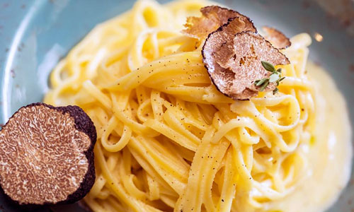 Tagliatelle al Tartufo pasta served in a bowl