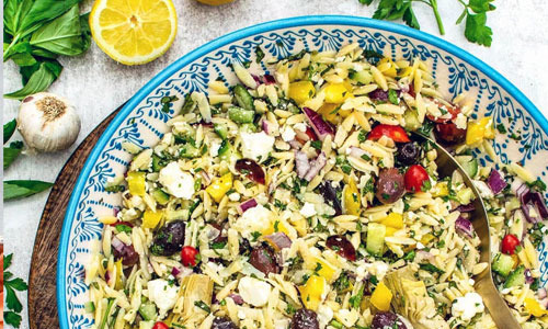 Mediterranean Orzo Salad in a wide serving bowl
