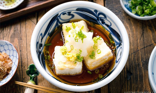 Agedashi Tofu served in a deep bowl with warm broth